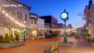 Washington Street Mall in Cape May, NJ, with clock and string lights at dusk.