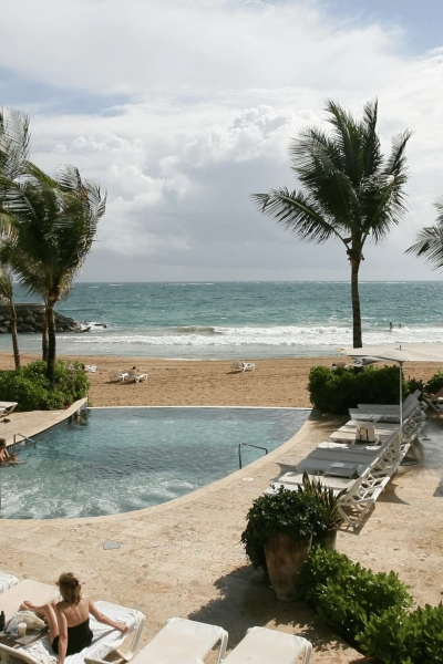 Beach resort pool with ocean view in San Juan, Puerto Rico.