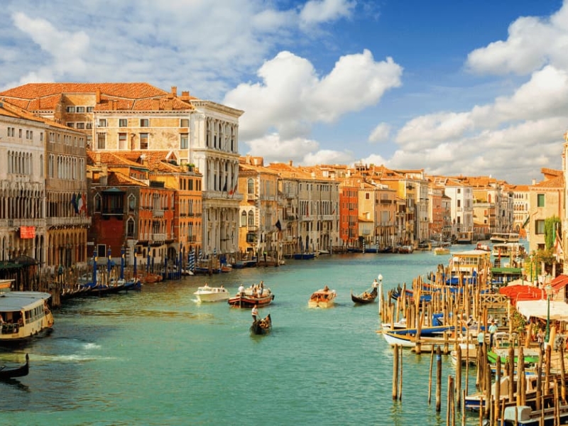 Scenic view of Grand Canal with gondolas and historic buildings in Venice, Italy