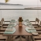Seaside Dining in St. Lucia – Oceanfront restaurant table set for six overlooking the Caribbean Sea.