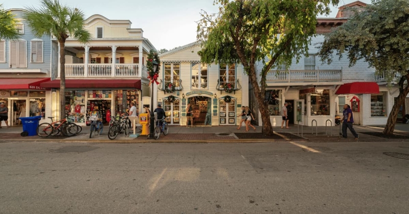 Shops and people along Duval Street in Key West, Florida.