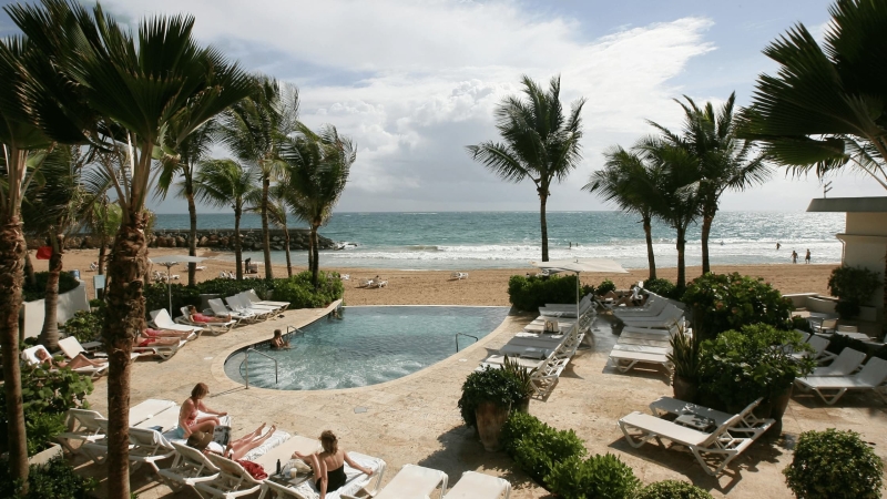 Beach resort pool with ocean view in San Juan, Puerto Rico.