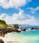 Scenic beach with turquoise water and rock formations in Bathsheba, Barbados.