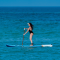 Paddleboarding in the Caribbean – Woman paddleboarding on turquoise waters off the coast of St. Lucia.
