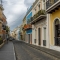Colorful colonial buildings along a cobblestone street in Old San Juan, Puerto Rico.