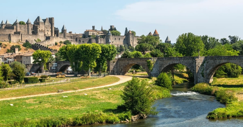 Medieval fortress city of Carcassonne with old stone bridge and scenic river view in France