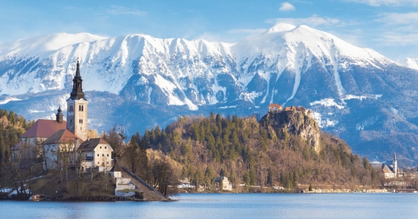 Lake Bled with Bled Island and Bled Castle, nestled in the Julian Alps of Slovenia, presents a breathtaking vista.