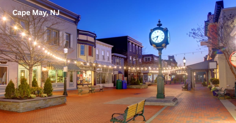 Washington Street Mall in Cape May, NJ, with clock and string lights at dusk.