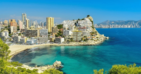 Beautiful coastal view of Benidorm with sandy beach, turquoise sea, and modern skyline in Alicante, Spain