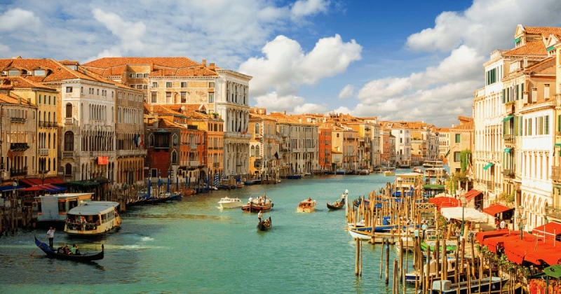Scenic view of Grand Canal with gondolas and historic buildings in Venice, Italy