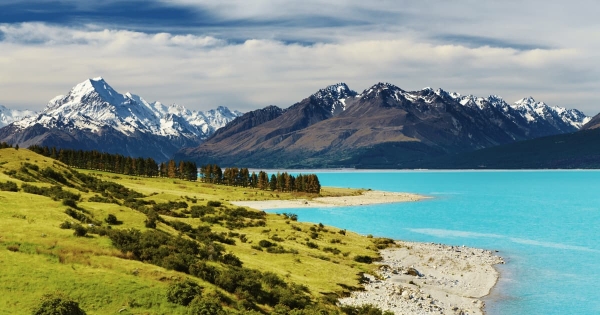 Turquoise waters of Lake Pukaki with Mount Cook and Southern Alps in the background, New Zealand