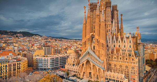 La Sagrada Familia, an architectural marvel in Barcelona, Spain, stands tall amidst the city's vibrant urban landscape.