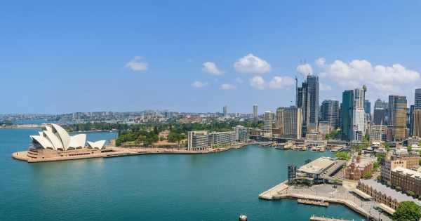 Sydney Opera House and Harbour with city skyline on a sunny day in Sydney, Australia.