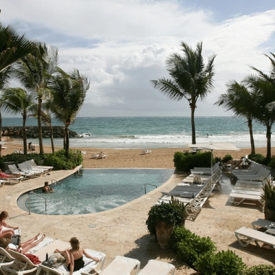 Beach resort pool with ocean view in San Juan, Puerto Rico.